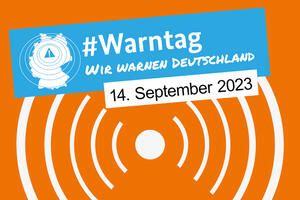 Bild vergrößern: Logo zum bundesweiten Warntag 2023 in blau und orange